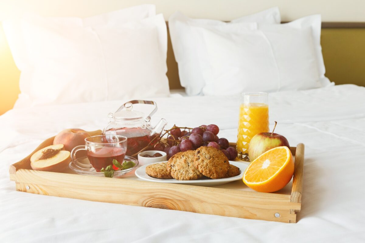 Breakfast served in bed on wooden tray