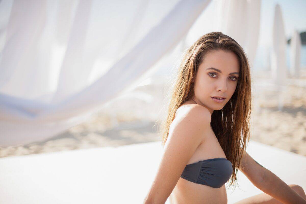 Portrait of young woman at beach, Castiadas, Sardinia, Italy