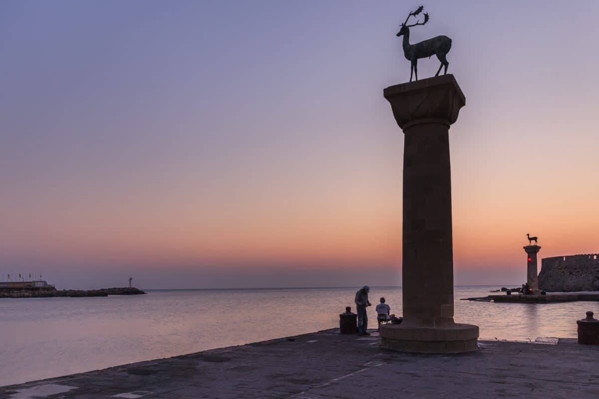 sunrise in Mandraki harbor. Rhodes, Greece